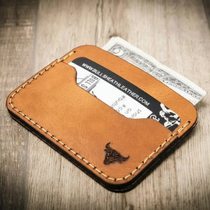 Brown leather card wallet with a card and dollar bill inside.