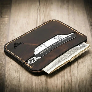Brown leather card wallet with cards and money visible
