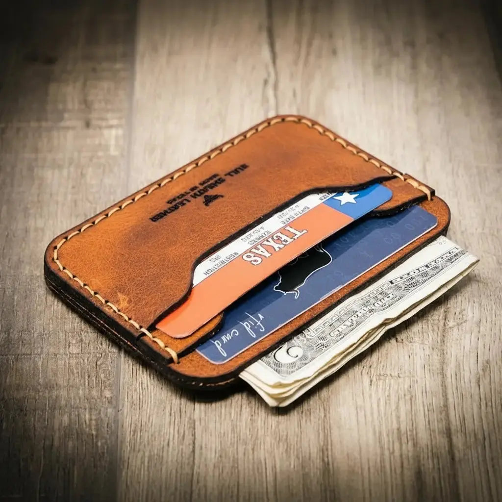 Brown leather minimalist card wallet with slots for cards and cash.
