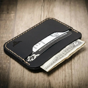 Pflugerville Card Wallet: black leather wallet with contrast stitching, holding a card and cash.