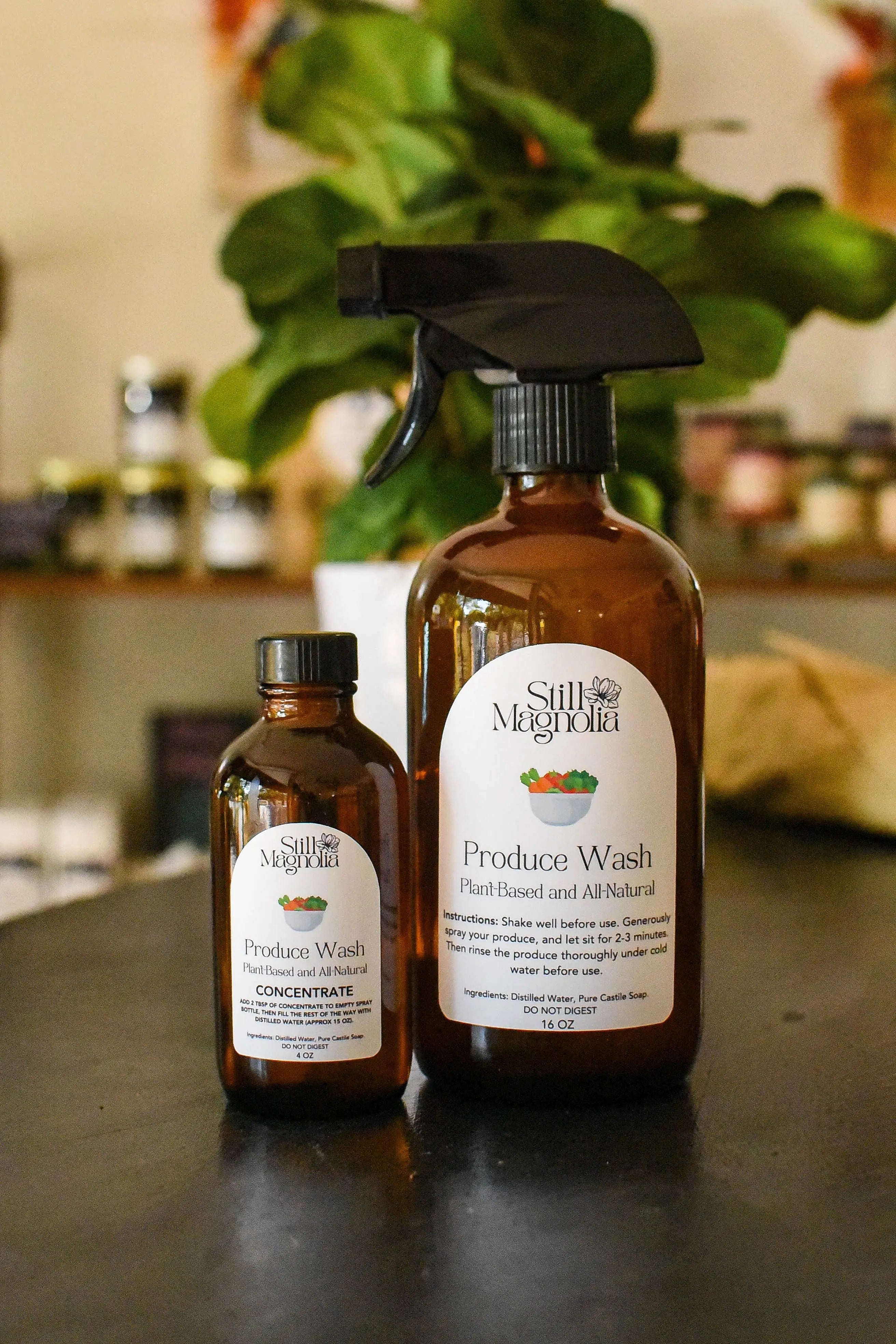 Still Magnolia plant-based produce wash concentrate and spray bottle.