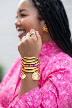 The Oyster Bangle in Gold detail view by The Tiny Tassel