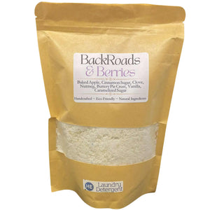 Bag of BackRoads & Berries laundry detergent in a brown paper bag with a see-through window showing the contents.