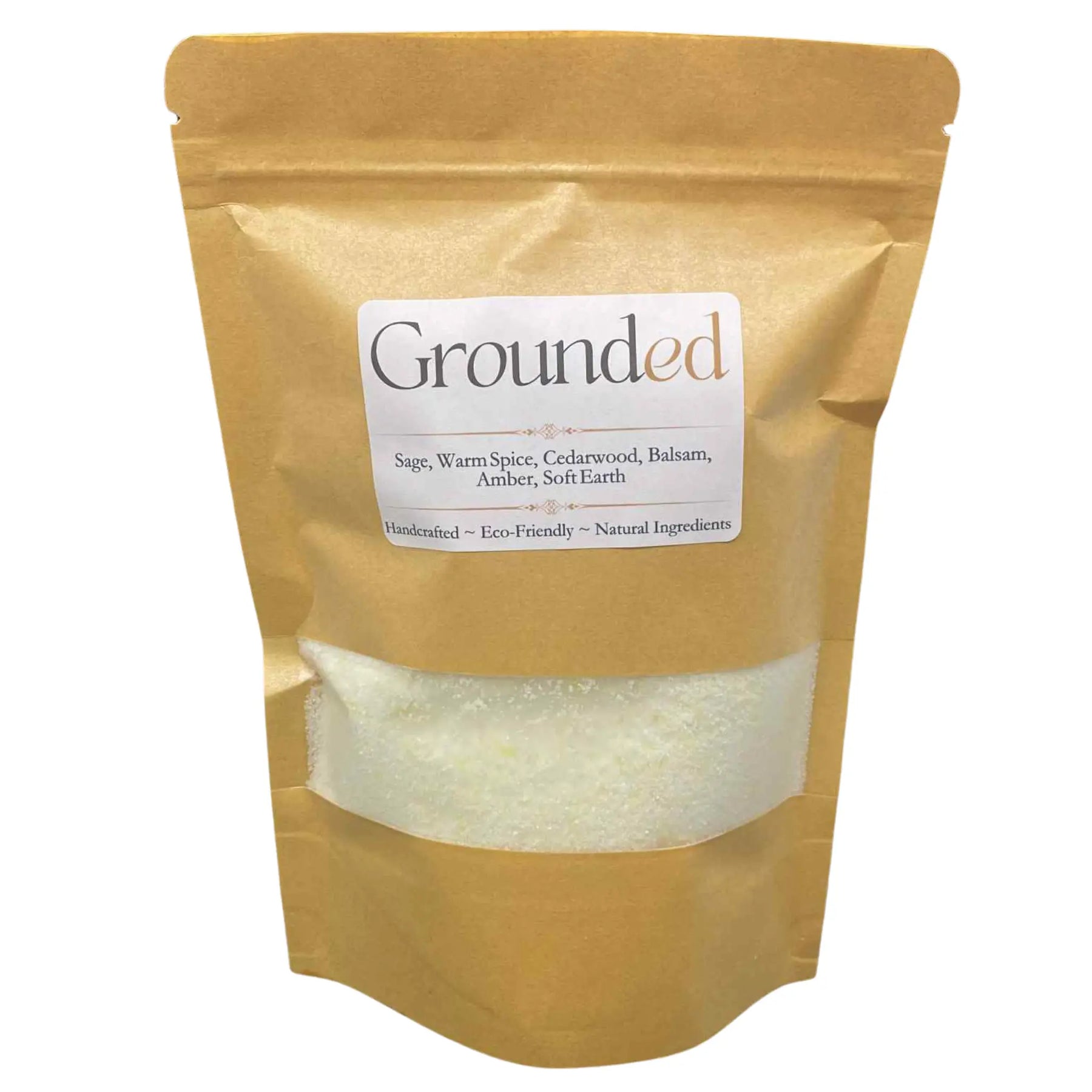 Kraft paper bag of Grounded laundry detergent with natural ingredients visible through a clear window.