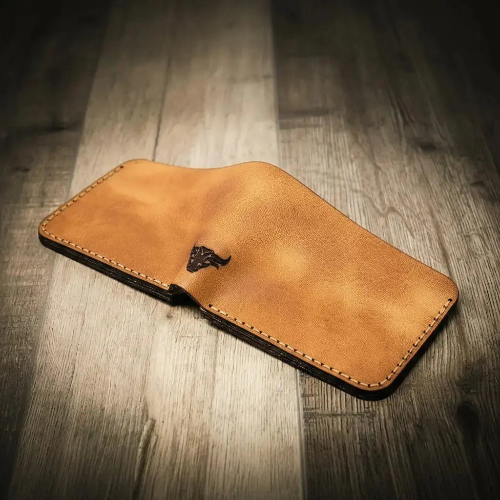 Brown leather bifold wallet with bull emblem