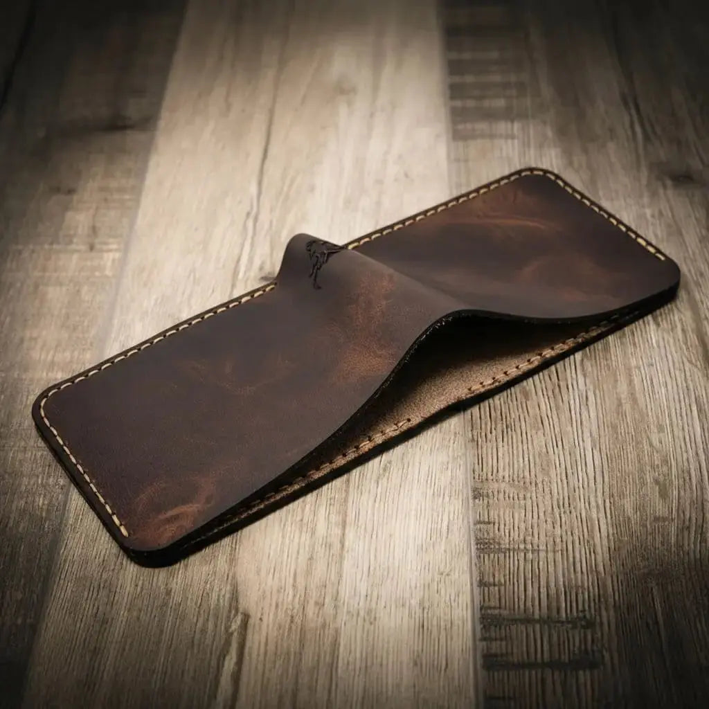 Brown leather bifold wallet with visible stitching