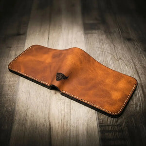 Rio Grande Bifold Wallet open brown leather with bull logo.