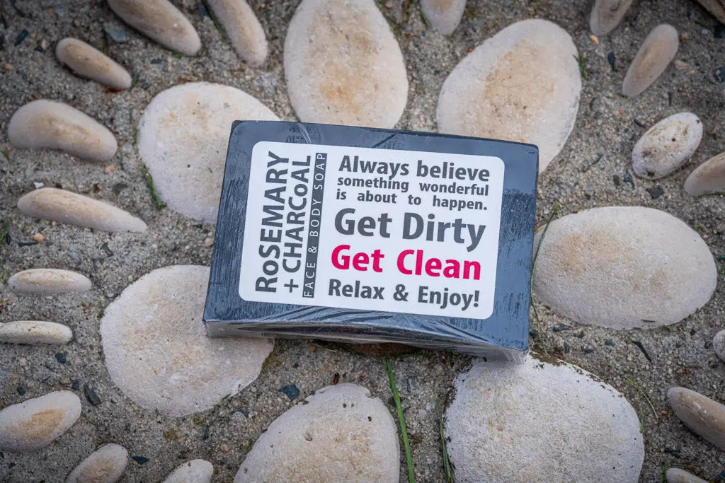 Rosemary + Charcoal face and body soap bar on stones