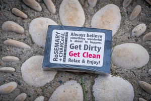 Rosemary + Charcoal face and body soap bar on stones