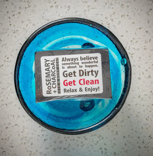 Rosemary + Charcoal Face & Body Soap bar in a blue bowl