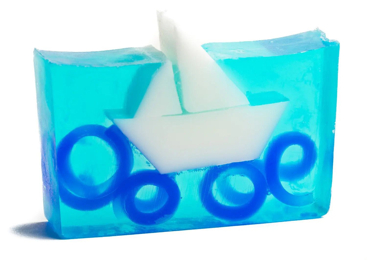 Transparent blue soap slice with white sailboat and blue wave rings