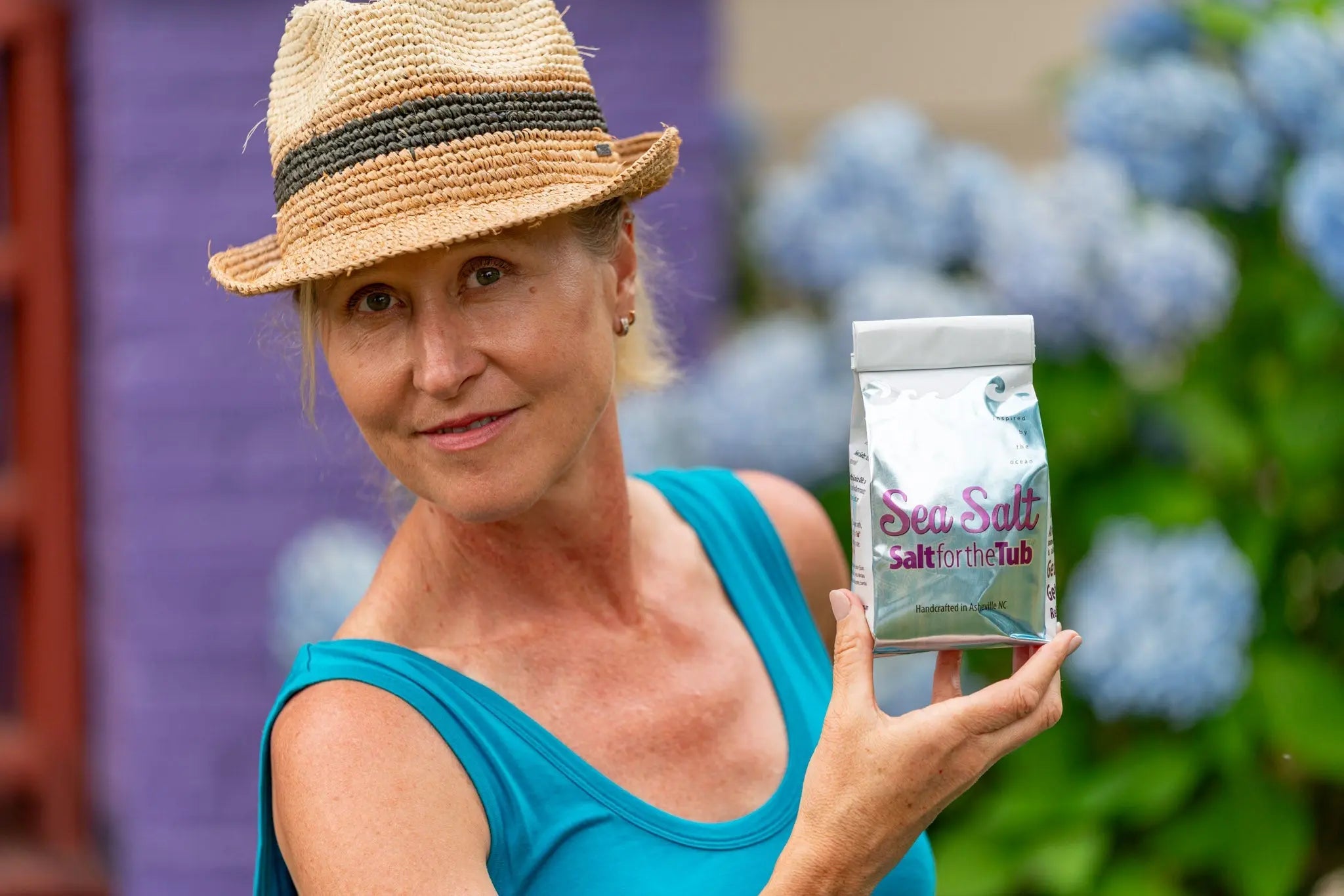 Sea Salt for the Tub bath salts bag held by a woman.