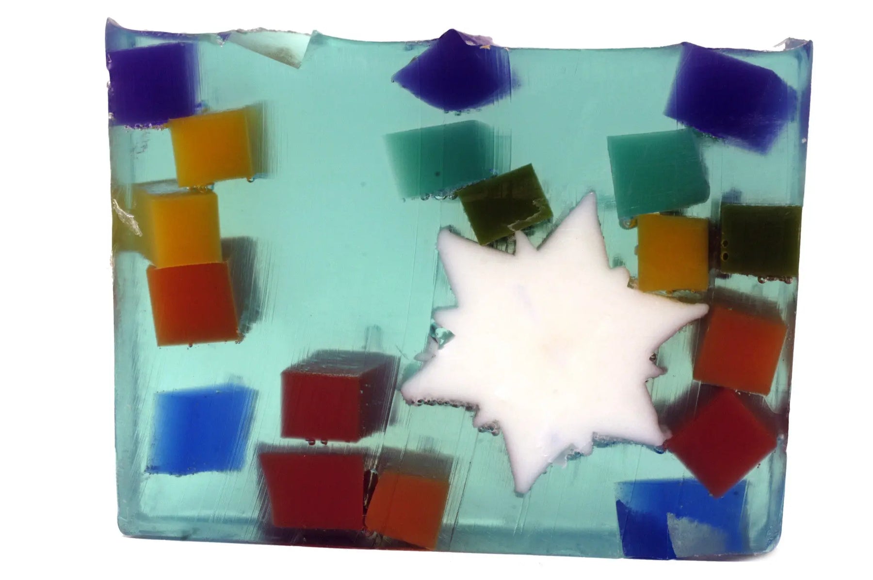 Blue soap slice with colorful square inclusions and a white Star of David shape.