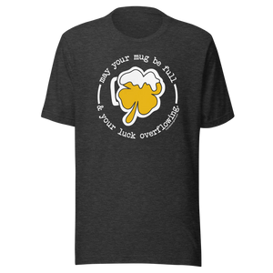 Dark grey t-shirt with a shamrock beer mug graphic and the phrase "May your mug be full & your luck overflowing."