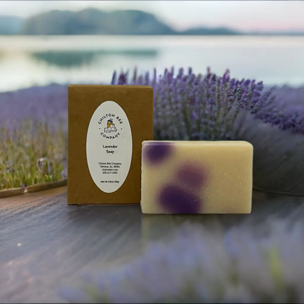 Chilton Bee Company Lavender Soap Bar and Box on a surface with lavender field and lake in background.