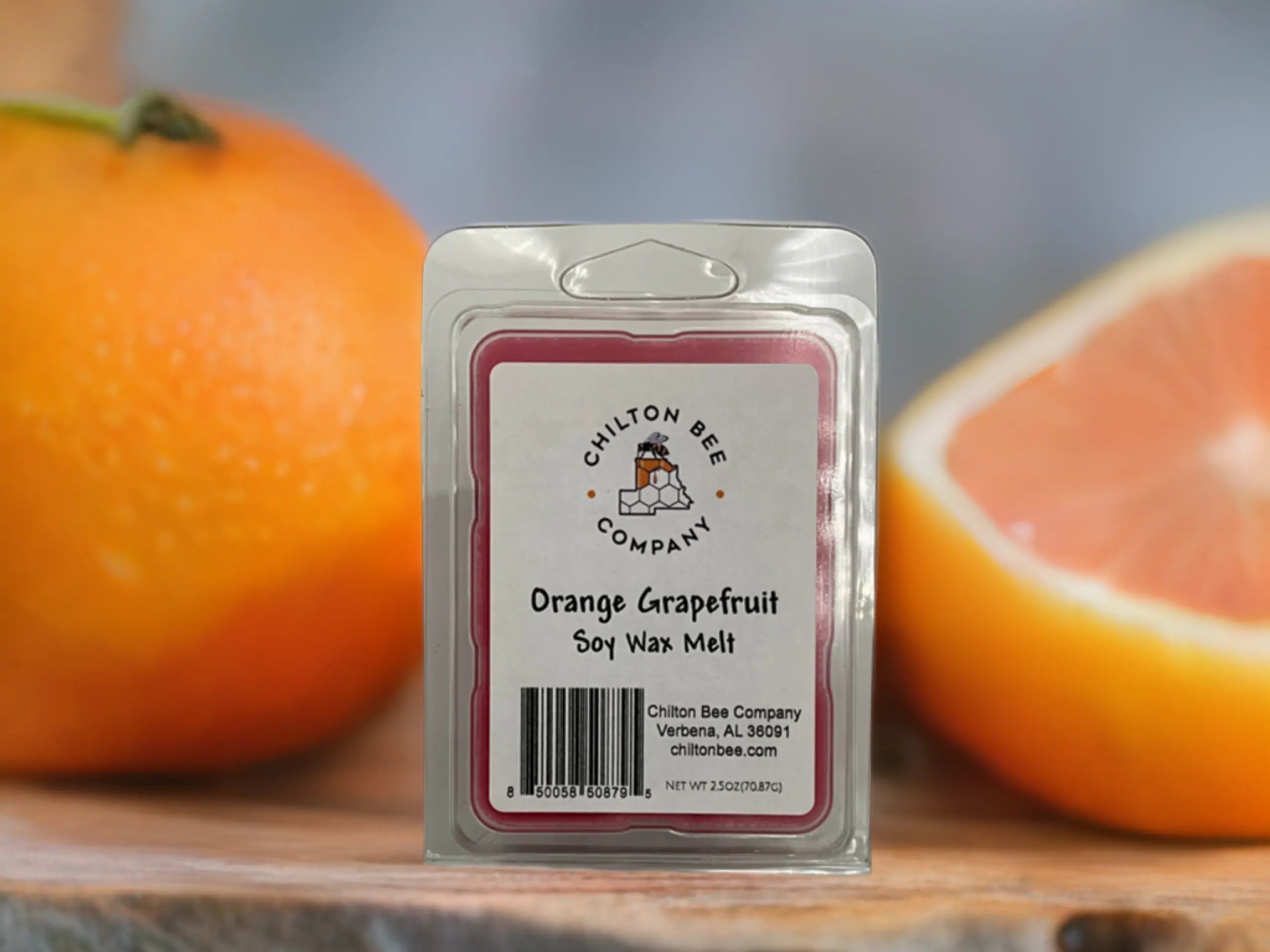 Orange Grapefruit Soy Wax Melt by Chilton Bee Company in clear packaging with orange and grapefruit.