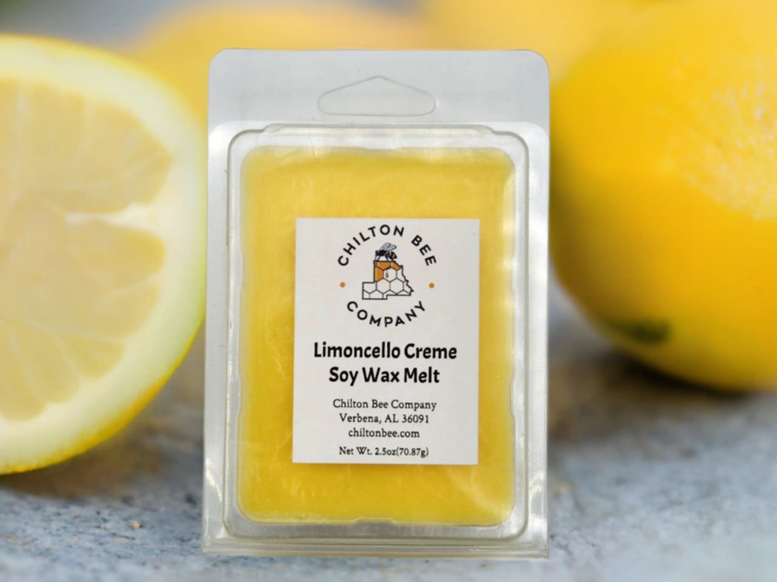 Chilton Bee Company Limoncello Creme soy wax melt in plastic packaging with lemons.