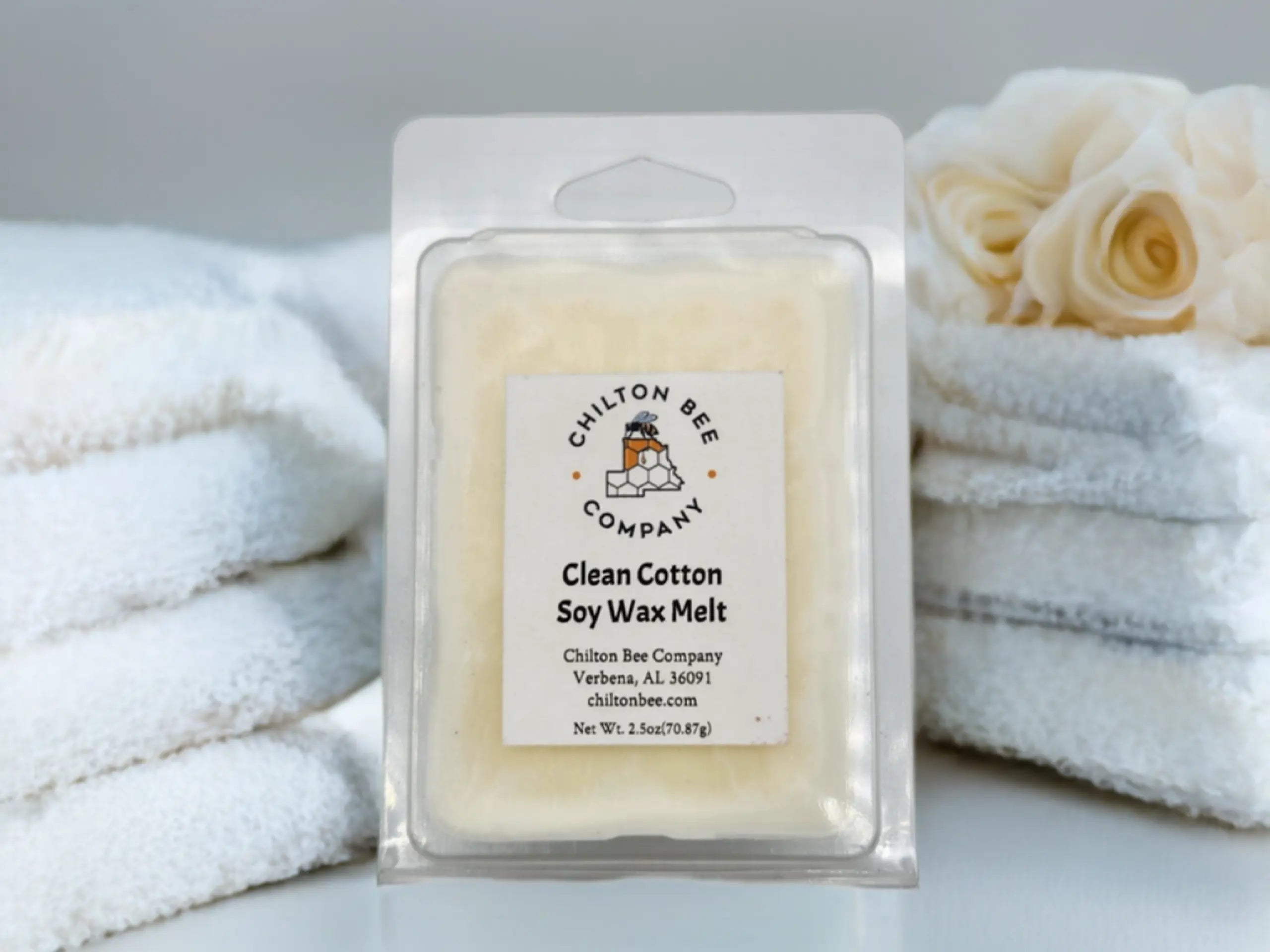Chilton Bee Company Clean Cotton soy wax melt in packaging with towels in background.