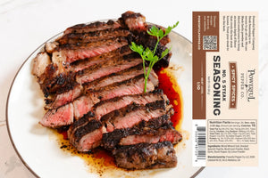 Steak seasoning No. 5 by Powerful Pepper Company on a plate with sliced steak.