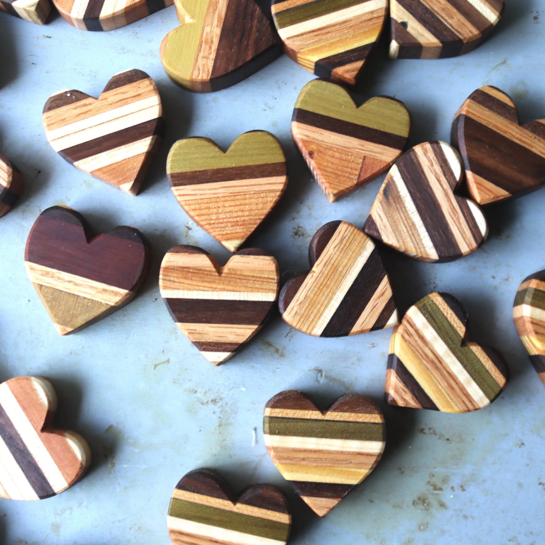 Striped wooden hearts in assorted wood tones