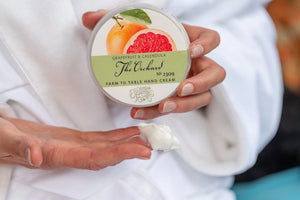 The Orchard Grapefruit & Calendula Farm to Table Hand Cream in a jar.