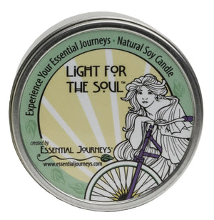 Essential Journeys natural soy candle in a decorative tin with artwork.