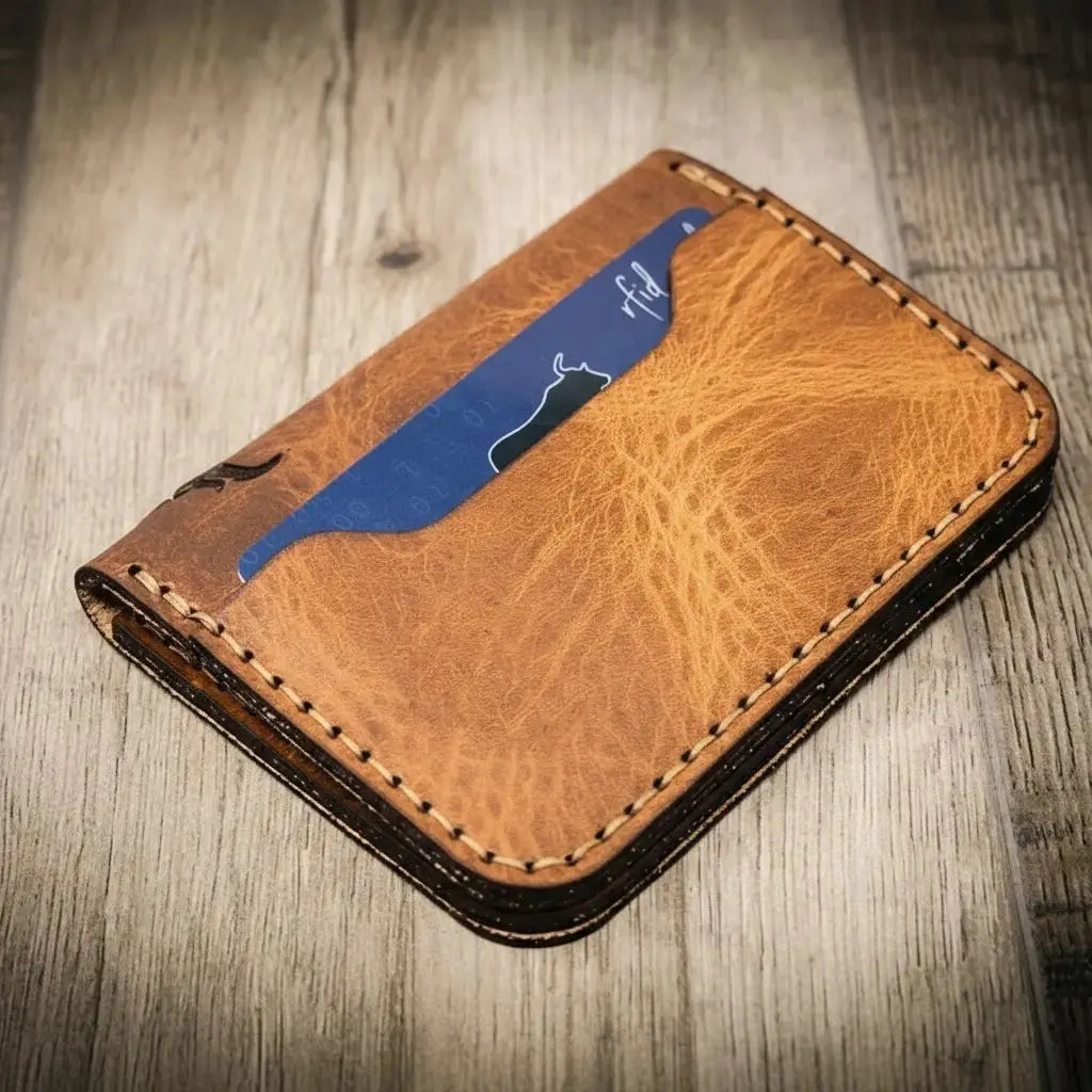 Brown leather bifold wallet with a blue card showing the word "rfid".