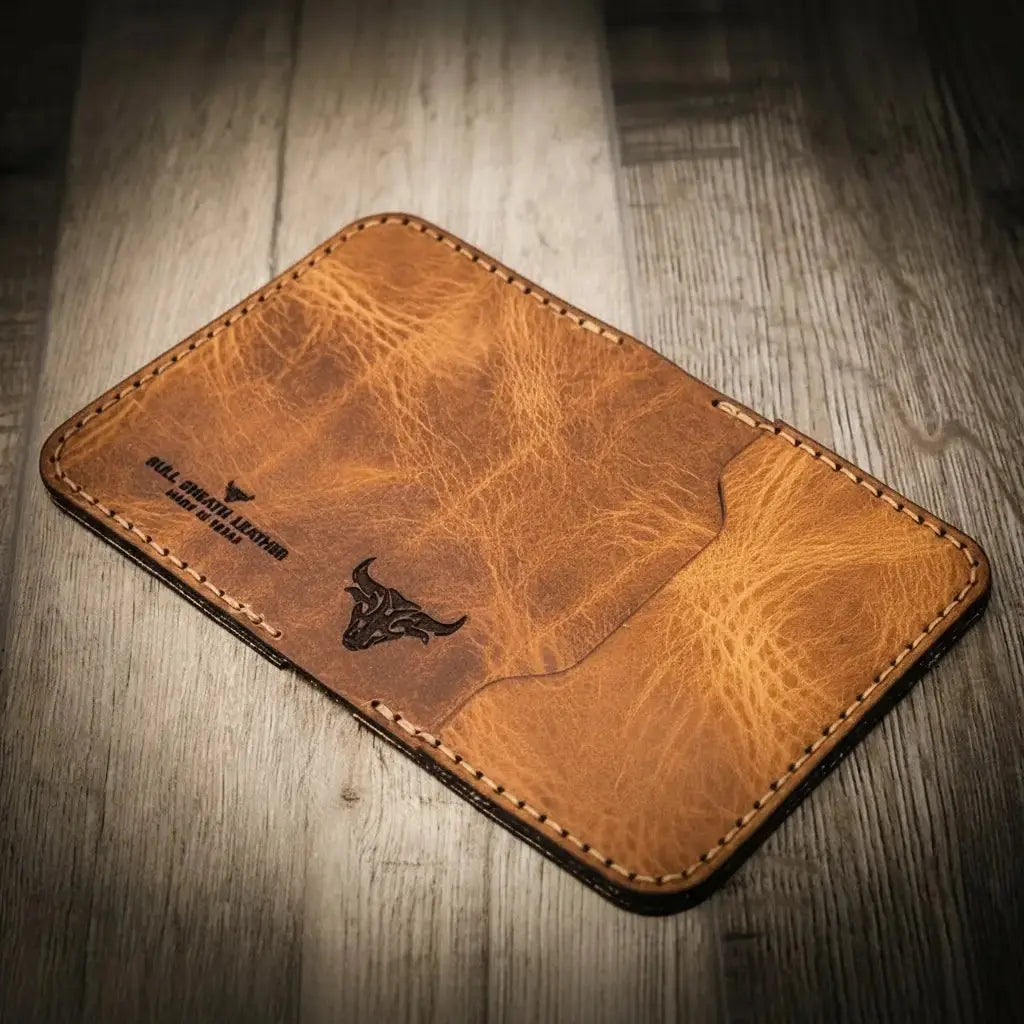 Brown distressed leather slim bifold wallet with embossed bull logo and stitching