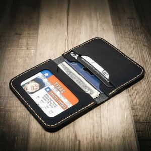 Black leather slim wallet showing a Texas driver's license and credit cards.