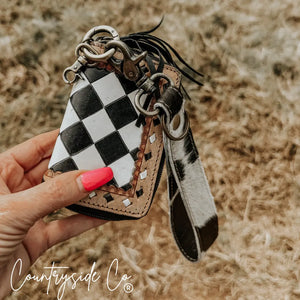 Checkered leather mini wallet keychain with cowhide wristlet and silver hardware.
