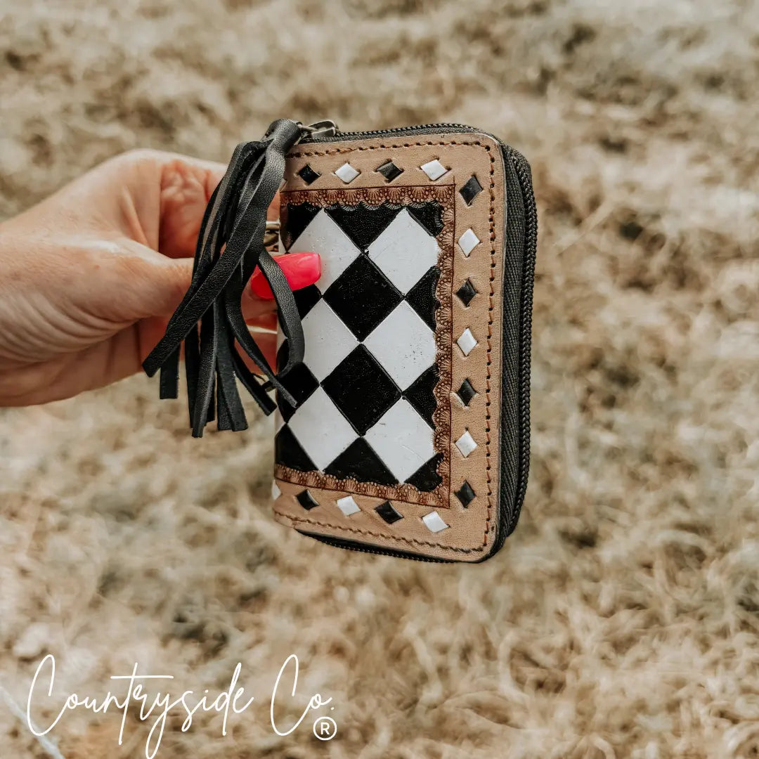 Checkered mini wallet keychain with leather and black tassel.