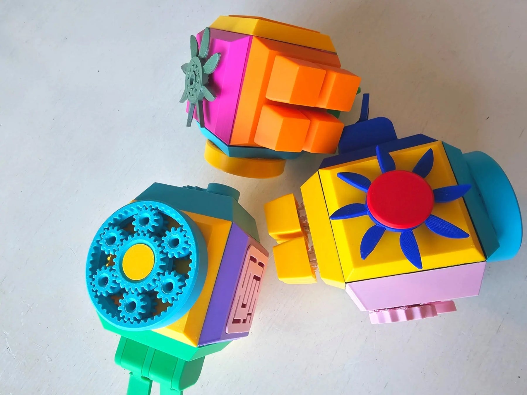 Colorful geometric fidget cube on a white background