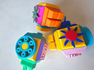 Colorful geometric fidget cube on a white background