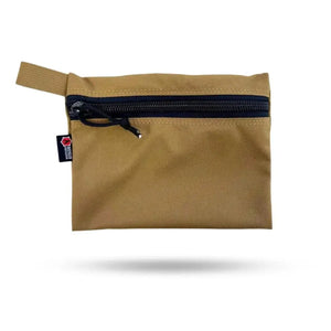Tan flat zippered gear pouch with black zipper and red/black logo tag.