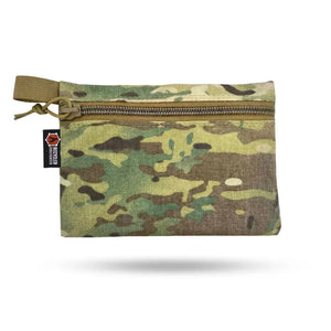 Multi-cam camouflage zippered pouch with pull tab and a small red and black logo tag.