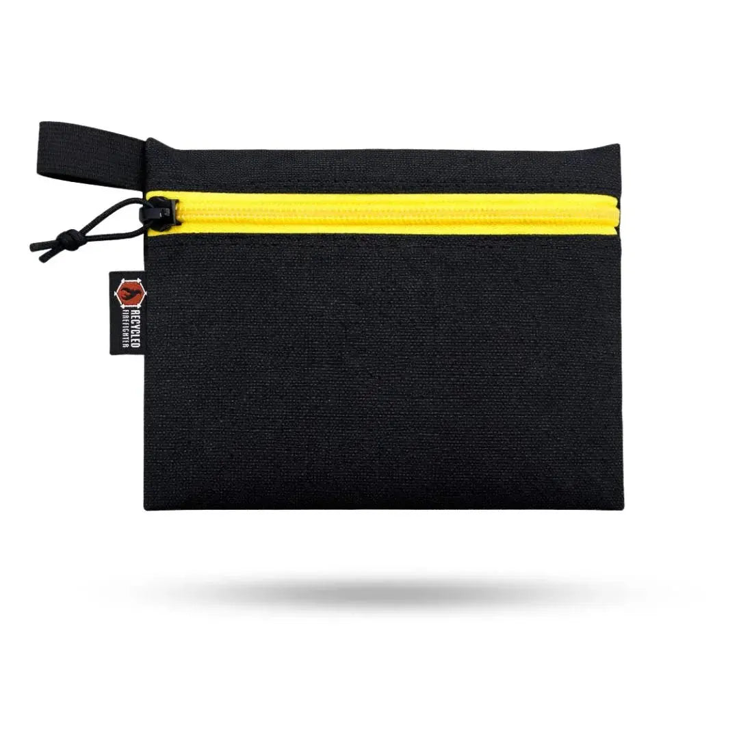 Black TRUCKIE large pouch with yellow zipper and "Recycled Firefighter" label.