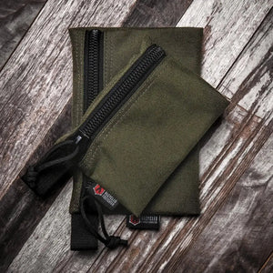 Two olive green zippered pouches, one larger than the other, with Recycled Firefighter logos.