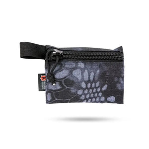 Small black camouflage zippered pouch with webbing loop and recycled firefighter tag.
