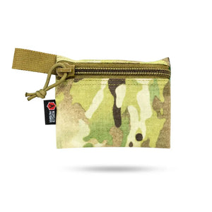 Camouflage zippered pouch with a tan webbing loop and a red/black brand tag.