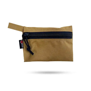 Tan zippered pouch with black zipper and a small label on the front.