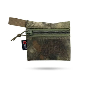 Small camo fabric zippered pouch with green zipper and webbing loop.