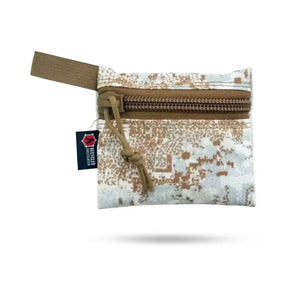 Small camouflage zippered pouch with a tan webbing loop and a "Recycled Firefighter" tag.