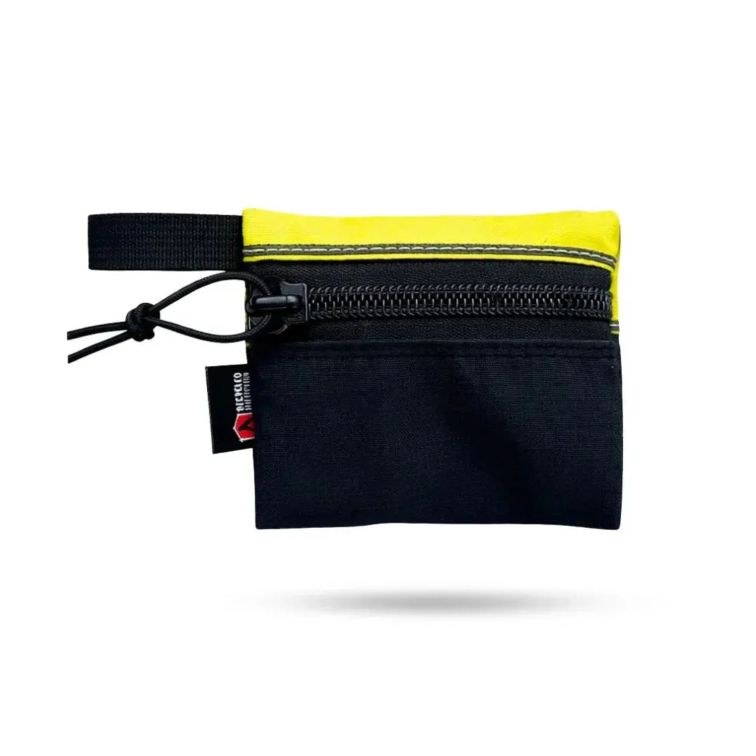 Small black and yellow zippered gear pouch with a carabiner clip and brand tag.
