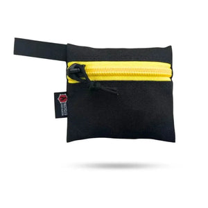 Small black pouch with yellow zipper and recycled firefighter tag.