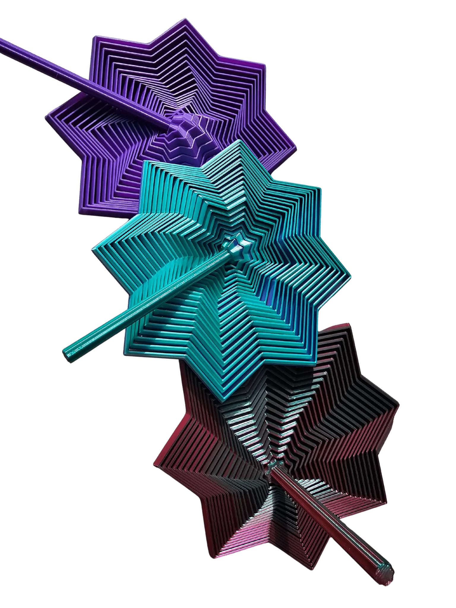 Three expanding star fidget toys stacked: purple, teal, and red with connecting rods on a black background.