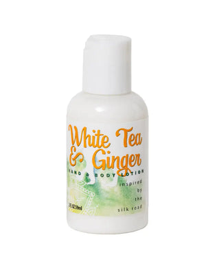 White Tea & Ginger hand and body lotion in a small white bottle.