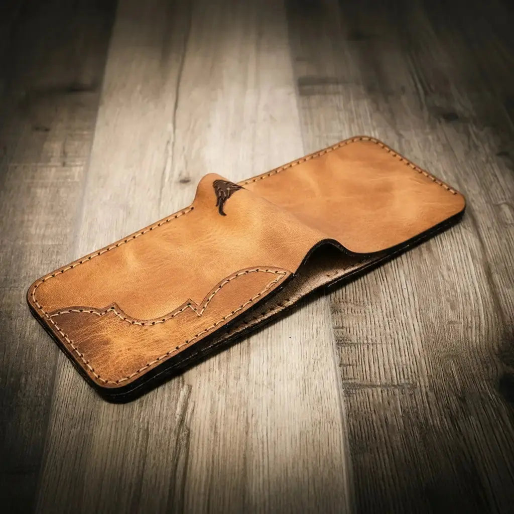 Brown leather bifold wallet with decorative stitching and embossed detail.