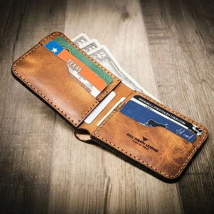 Brown leather bifold wallet with cards and cash