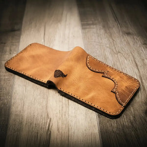 Brown leather bifold wallet with decorative stitching and embossed emblem.