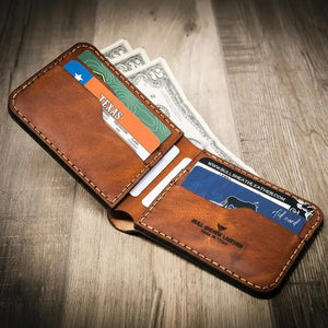 Brown leather bifold wallet with Texas ID and currency visible.